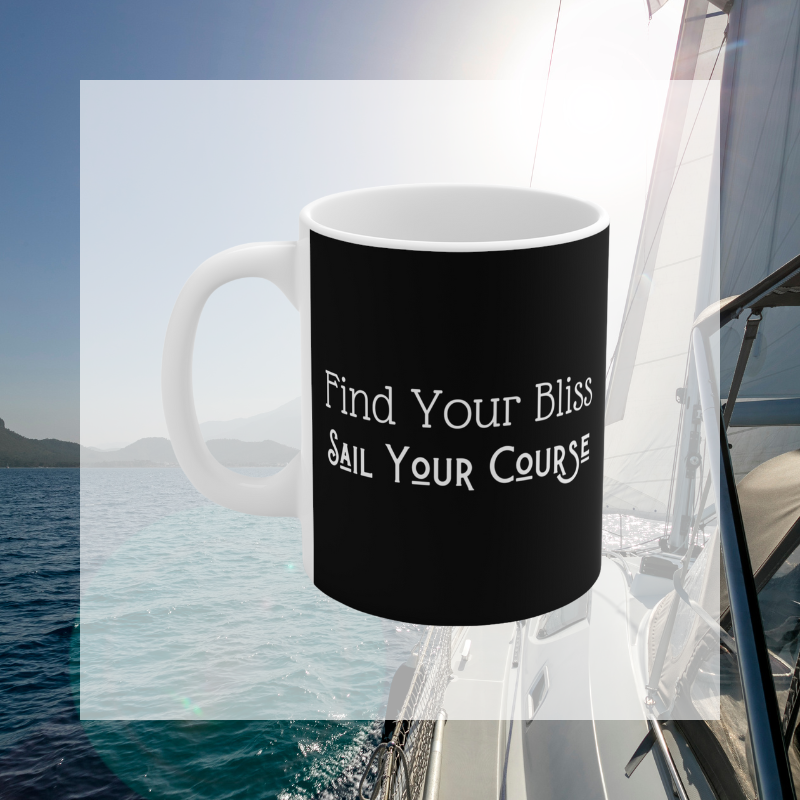Elegant black coffee mug featuring the motivational text 'Find Your Bliss, Sail Your Course' alongside a serene sunset sailing scene, perfect for adventurers and dreamers.