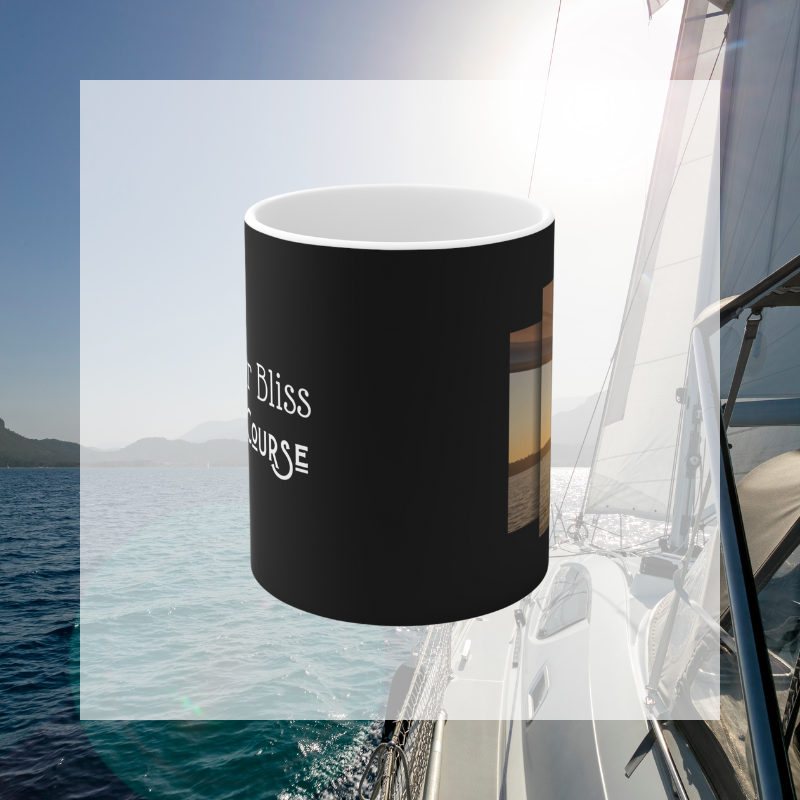 Elegant black coffee mug featuring the motivational text 'Find Your Bliss, Sail Your Course' alongside a serene sunset sailing scene, perfect for adventurers and dreamers.