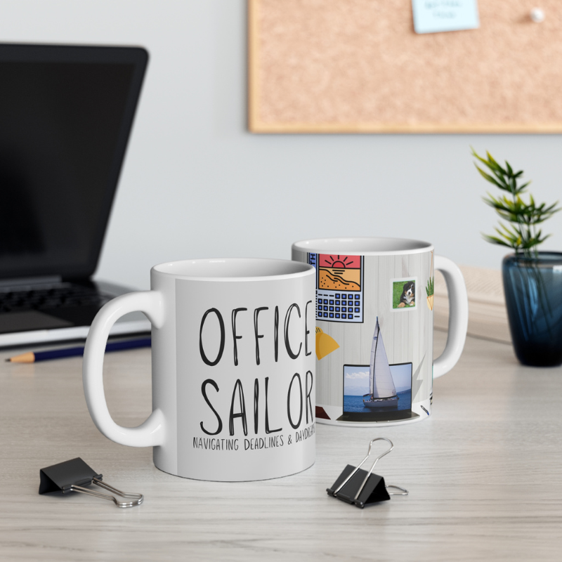 Light gray coffee mug with the text 'Office Sailor: Navigating Deadlines & Daydreams,' featuring a design of a sailboat on a computer screen, blending work-life with nautical inspiration.