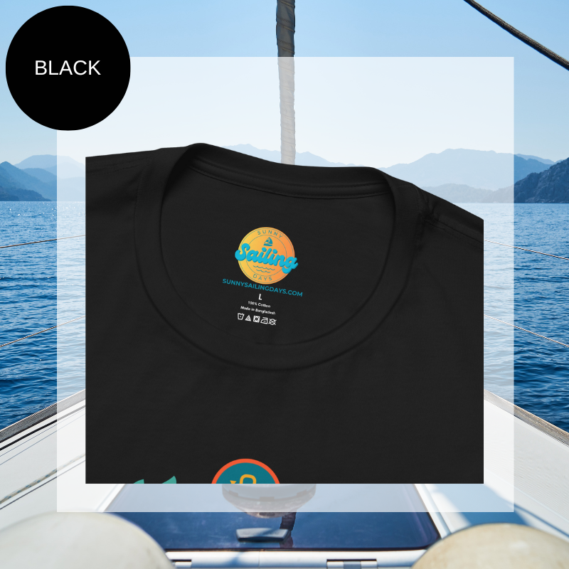 Black unisex t-shirt featuring a vibrant 'Sailyacht Community' design with a sailboat, laurel wreath, and retro sunset, displayed on a yacht deck background.