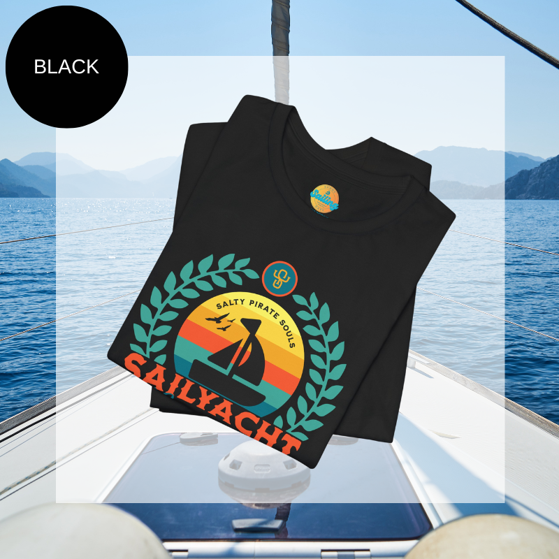 Black unisex t-shirt featuring a vibrant 'Sailyacht Community' design with a sailboat, laurel wreath, and retro sunset, displayed on a yacht deck background.