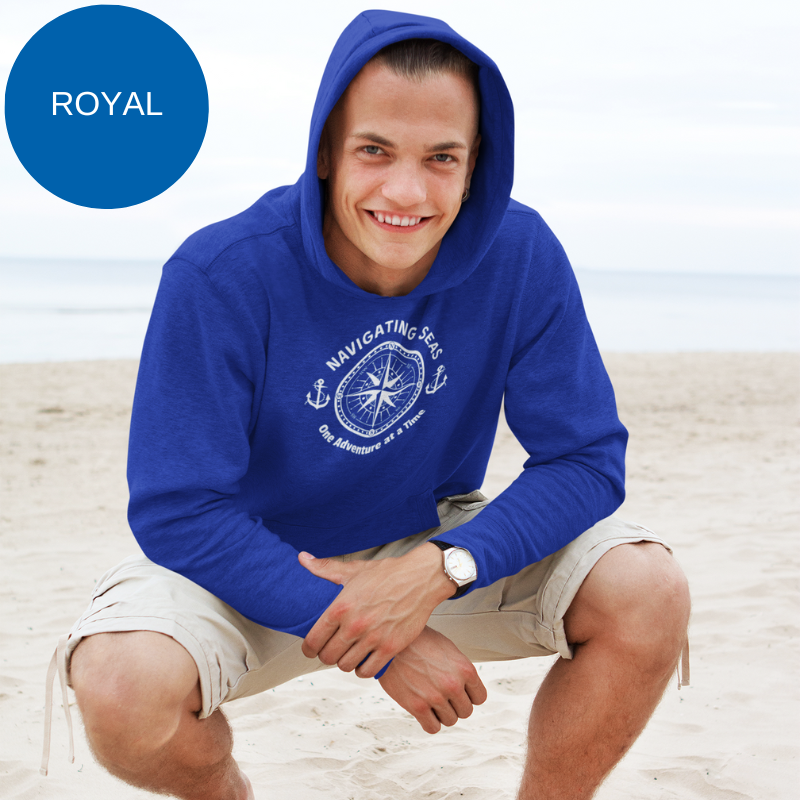 Royal blue hoodie featuring a nautical compass and anchor design with the text 'Navigating Seas - One Adventure at a Time,' perfect for sailors and ocean enthusiasts.