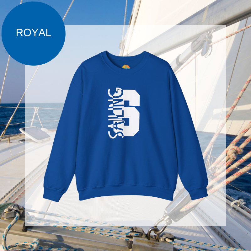 Black sweatshirt featuring a bold vertical 'S' with the word 'SAILING' integrated into the design, displayed on a sailboat deck with ocean and sky in the background.