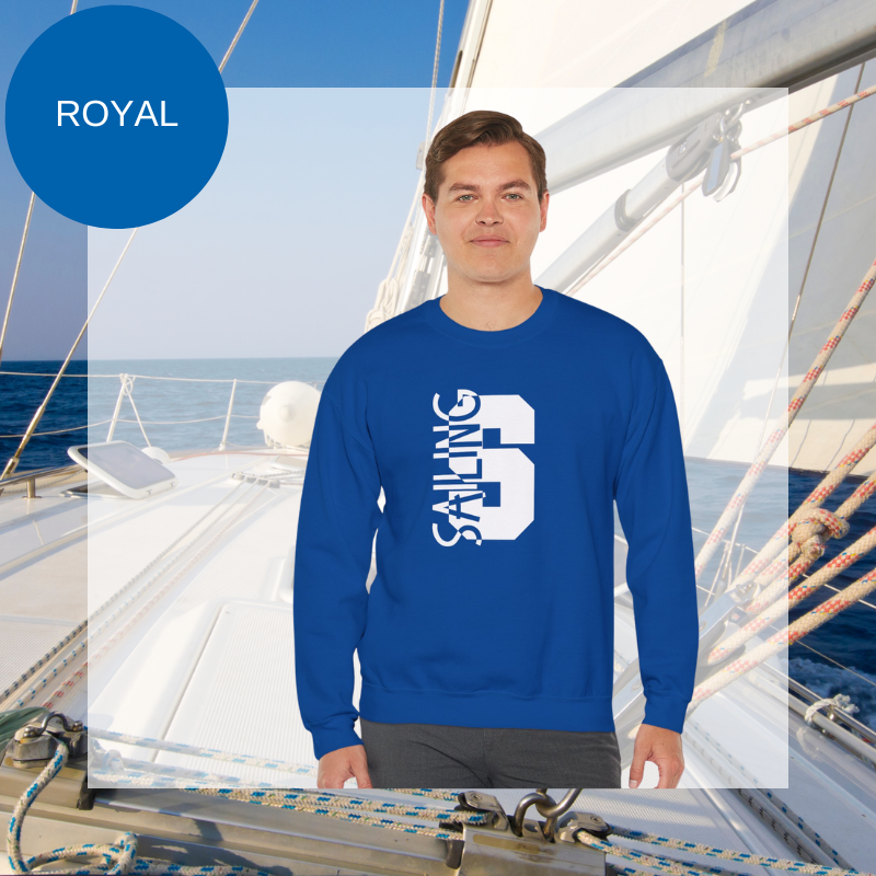 Black sweatshirt featuring a bold vertical 'S' with the word 'SAILING' integrated into the design, displayed on a sailboat deck with ocean and sky in the background.