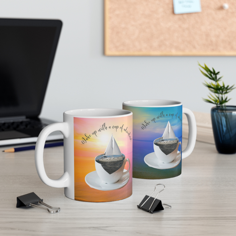 Scenic coffee mug featuring a sailboat floating in a coffee cup with the text 'Wake up with a cup of adventure,' perfect for sailors and dreamers.