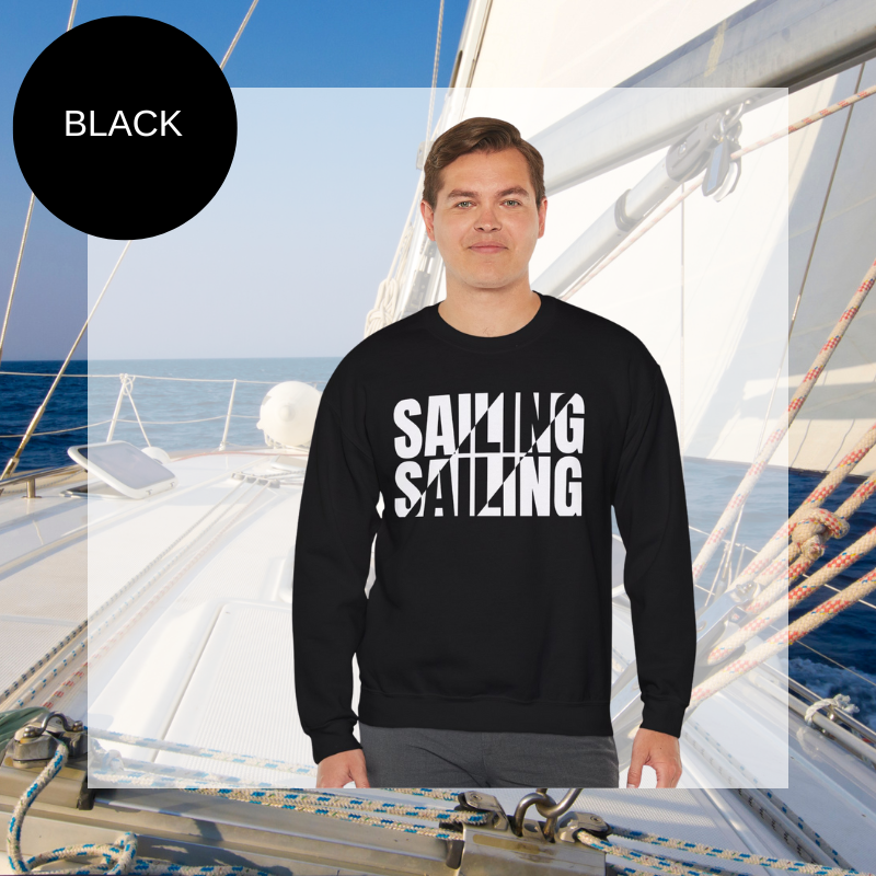 A black men's sweatshirt with a bold white "SAILING" split text design, displayed against a sailing yacht background.