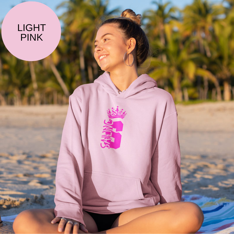 Light pink hoodie featuring a bold design with the word 'Sailing' and a crown graphic, perfect for expressing nautical style with a touch of elegance.s
