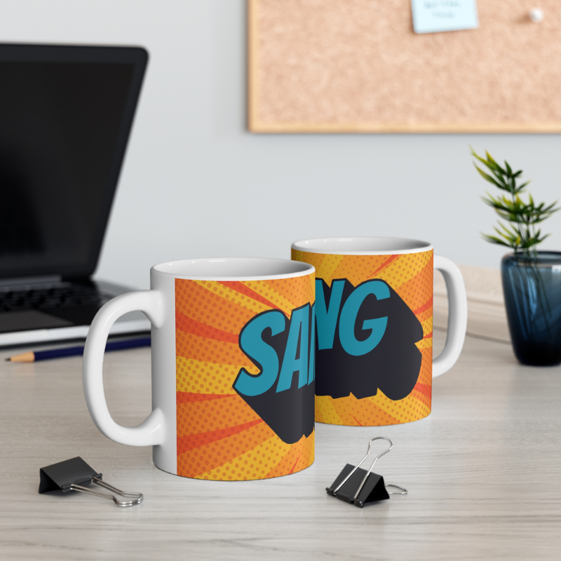 Vibrant coffee mug featuring a comic book-style design with bold, colorful Sailing text and dynamic orange and yellow background. Perfect for adding a splash of fun to your daily coffee routine.