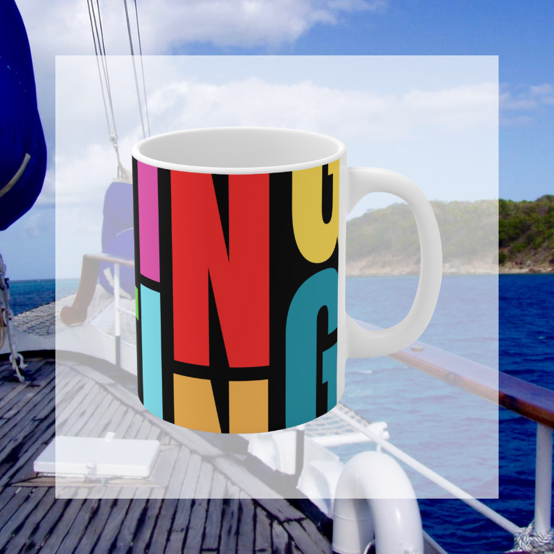 Colorful coffee mug with a bold, artistic 'SAILING' typography design, perfect for adding a vibrant nautical touch to your morning routine or gifting to sailing enthusiasts.