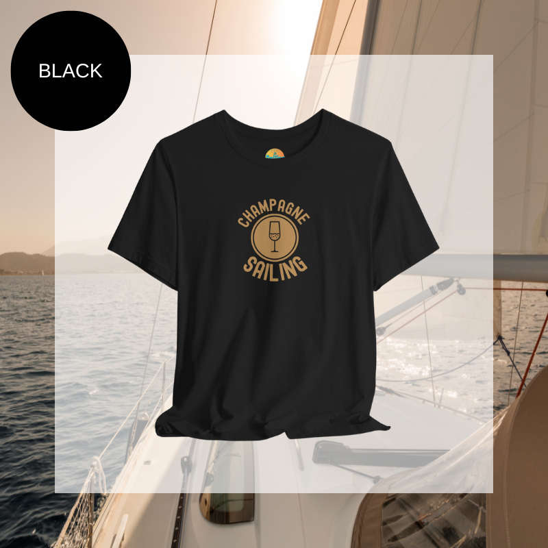 Black t-shirt featuring a minimalist design with the text 'Champagne Sailing' in elegant gold lettering and a simple champagne glass icon, perfect for lovers of luxurious sailing vibes.