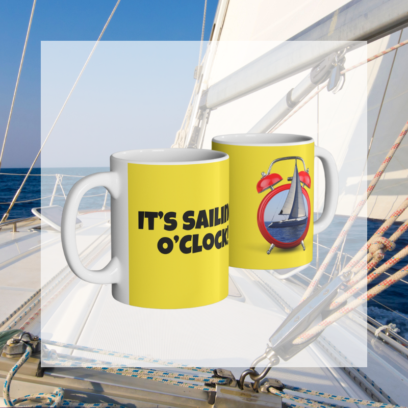 Bright yellow coffee mug featuring the playful text 'It's Sailing O'Clock!' and an alarm clock design with a sailboat inside, perfect for sailing enthusiasts ready to set sail at any time