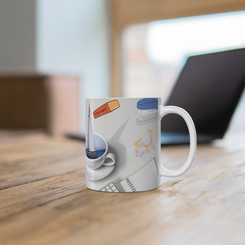 Blue coffee mug with the text 'Office Sailor: Navigating Deadlines & Daydreams,' featuring a playful design of a sailboat inside a coffee cup, perfect for combining work vibes with sailing dreams