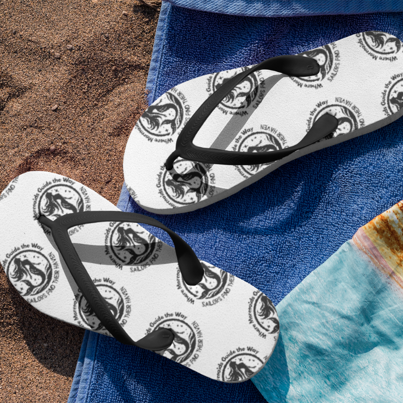 White flip-flops featuring a nautical mermaid design with the text 'Where Mermaids Guide the Way, Sailors Find Their Haven,' perfect for beach days or sailing adventures.
