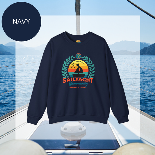 A navy men's sweatshirt featuring a colorful nautical design with the text "Sailyacht Community" and "Salty Pirate Souls Unsinkable Spirit," displayed on a sailboat background.
