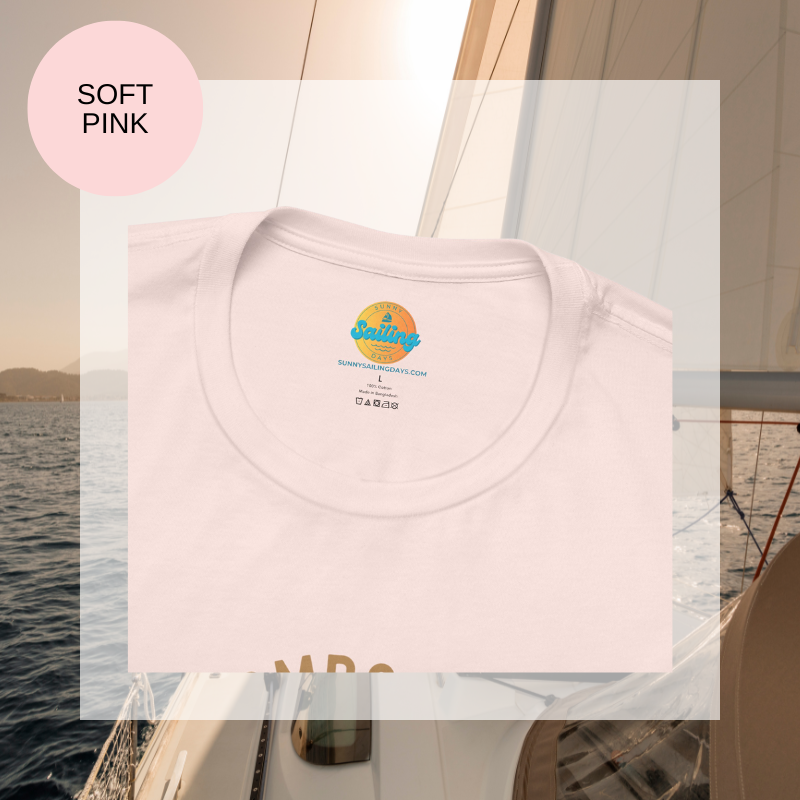 Soft pink t-shirt featuring a minimalist design with the text 'Champagne Sailing' in elegant gold lettering and a simple champagne glass icon, perfect for lovers of luxurious sailing vibes.