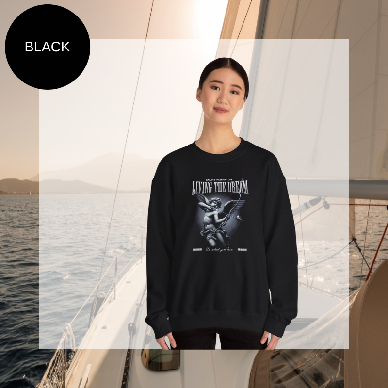 Black women's sweatshirt with 'Living the Dream' nautical-themed print, featuring an artistic sailor-inspired design, perfect for sailing enthusiasts.