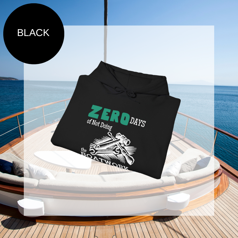 Black hoodie featuring the humorous sailing-themed text 'ZERO DAYS of Not Doing the BOATWORK,' ideal for passionate boaters who embrace the never-ending tasks of boat maintenance.