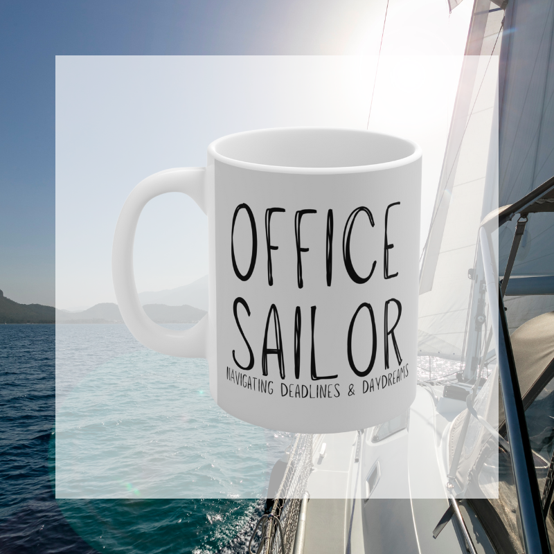 Light gray coffee mug with the text 'Office Sailor: Navigating Deadlines & Daydreams,' featuring a design of a sailboat on a computer screen, blending work-life with nautical inspiration.