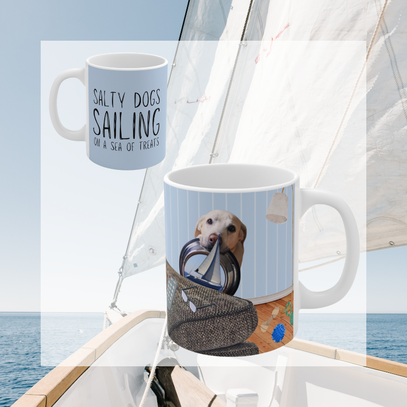 Light blue coffee mug featuring the text 'Salty Dogs Sailing on a Sea of Treats' with a playful illustration of a dog holding a food bowl with a sailboat in it, perfect for dog-loving sailors.