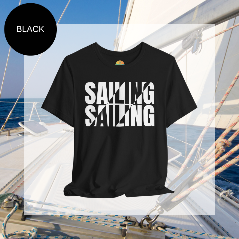 Black unisex t-shirt with bold white text design reading 'Sailing Sailing,' displayed on a yacht deck with a nautical background.