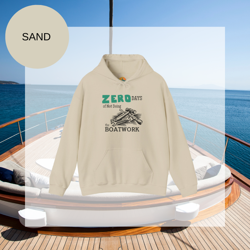 Sand colored hoodie featuring the humorous sailing-themed text 'ZERO DAYS of Not Doing the BOATWORK,' ideal for passionate boaters who embrace the never-ending tasks of boat maintenance.