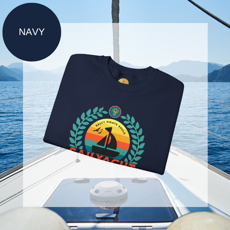 A navy men's sweatshirt featuring a colorful nautical design with the text "Sailyacht Community" and "Salty Pirate Souls Unsinkable Spirit," displayed on a sailboat background.