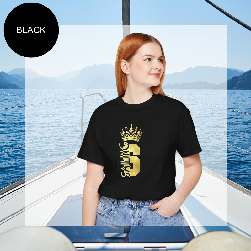 Black t-shirt with a gold crown graphic and the word 'SAILING' written vertically within the bold letter 'S', creating a regal and nautical-themed design.