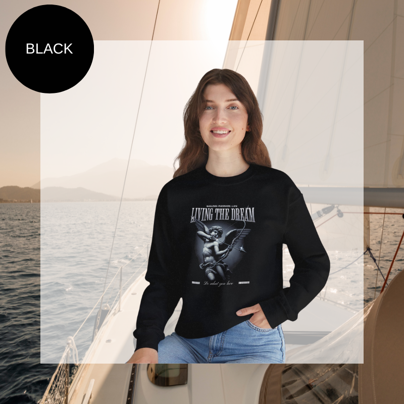 Black women's sweatshirt with 'Living the Dream' nautical-themed print, featuring an artistic sailor-inspired design, perfect for sailing enthusiasts.