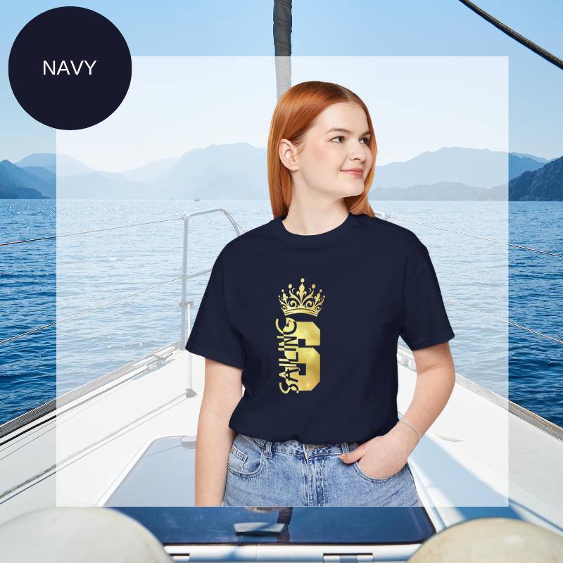 Navy blue t-shirt with a gold crown graphic and the word 'SAILING' written vertically within the bold letter 'S', creating a regal and nautical-themed design.