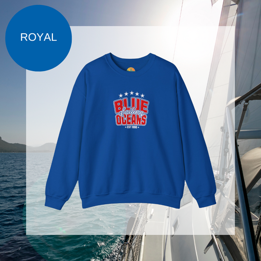 Navy blue sweatshirt featuring the text 'Blue Sailing Oceans - Est. 1990' in bold red and white with star accents, perfect for nautical enthusiasts.