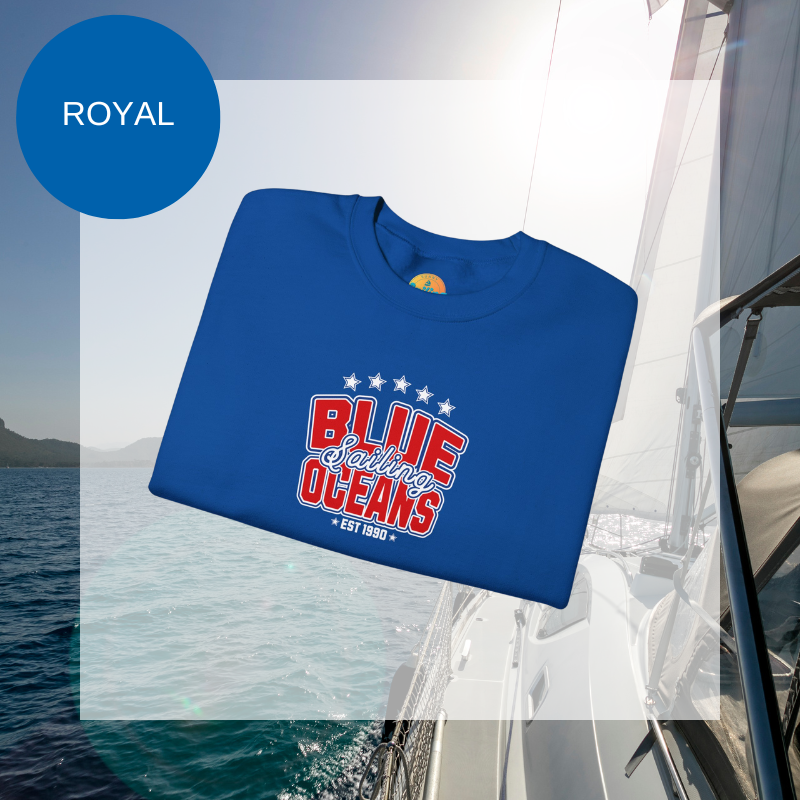Navy blue sweatshirt featuring the text 'Blue Sailing Oceans - Est. 1990' in bold red and white with star accents, perfect for nautical enthusiasts.